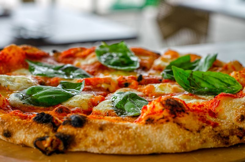 Gourmet deweys pizza with fresh colorful toppings